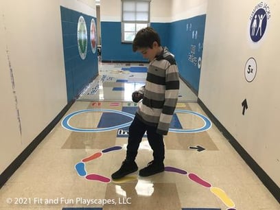 child on a fit and fun sensory pathway for schools