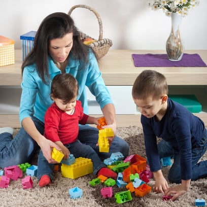 children engaging in sensory play with legos